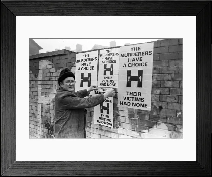 Framed Print : Launch Of Poster Campaign To Highlight Victims Plight Mr Tom Passmore putting up