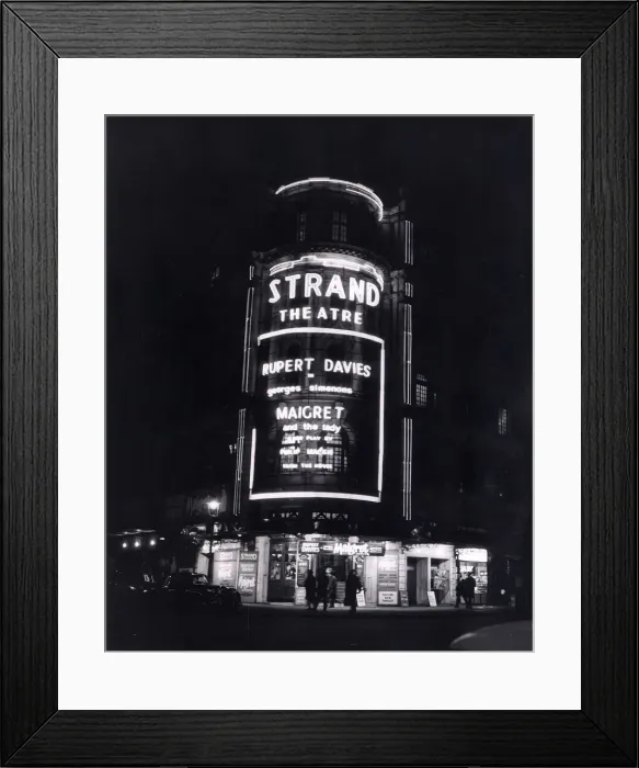 Framed Print : The Strand Theatre London is lit up at night in Neon Lights to advertise the Play Framed Print : The Strand Theatre London is lit up at night in Neon Lights to advertise the Play