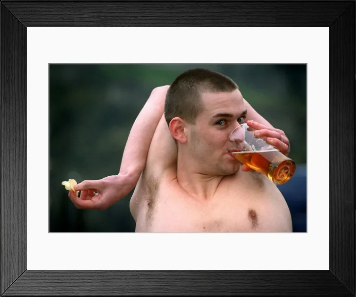 Framed Print : Douglas Kidd drinking glass pint of lager with his arm bent around the back of his head Framed Print : Douglas Kidd drinking glass pint of lager with his arm bent around the back of his head