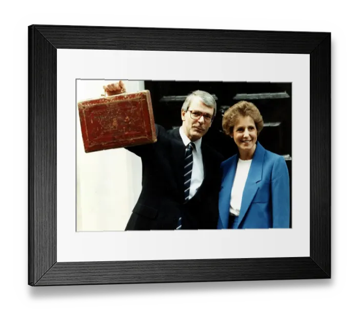 Framed Print : John Major seen here as Chancellor holding up the red budget box with wife Norma Major