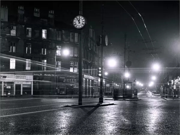 Gorbals Cross Glasgow Scotland the hands on the lamp posts showing five to Midnight