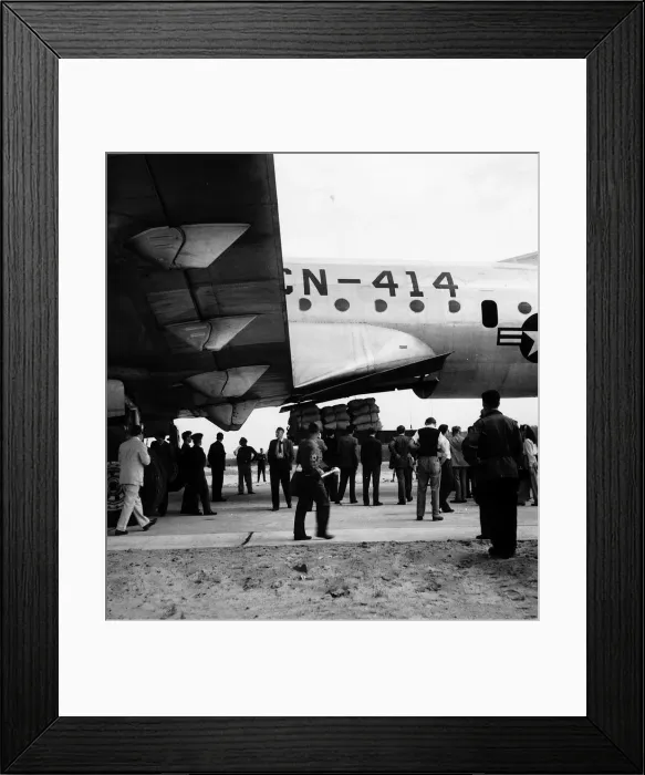 Framed Print : Berlin Airlift Circa 1948 A aircraft from the American Airforce unloads Framed Print : Berlin Airlift Circa 1948 A aircraft from the American Airforce unloads