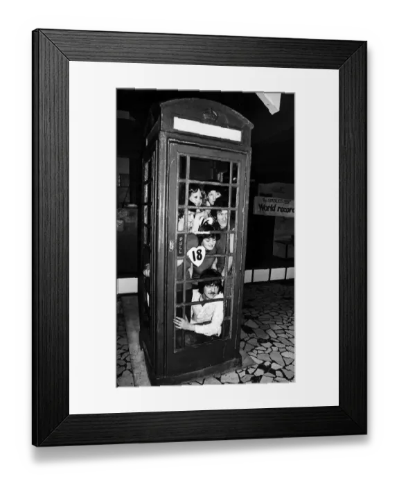 Framed Print : Twenty people set a record for squeezing into a telephone box. January 1978