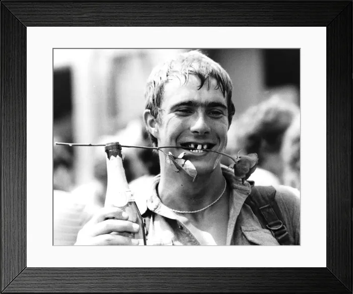 Framed Print : Marty Coveney returns from the Falklands War with a drink, a grin and a rose Framed Print : Marty Coveney returns from the Falklands War with a drink, a grin and a rose