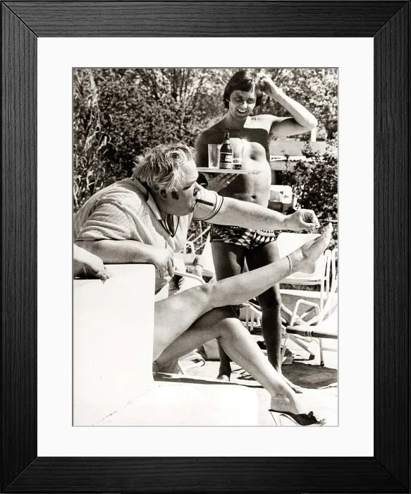 Framed Print : Man painting toe nails - deceptive angle makes it look like man is painting his Framed Print : Man painting toe nails - deceptive angle makes it look like man is painting his