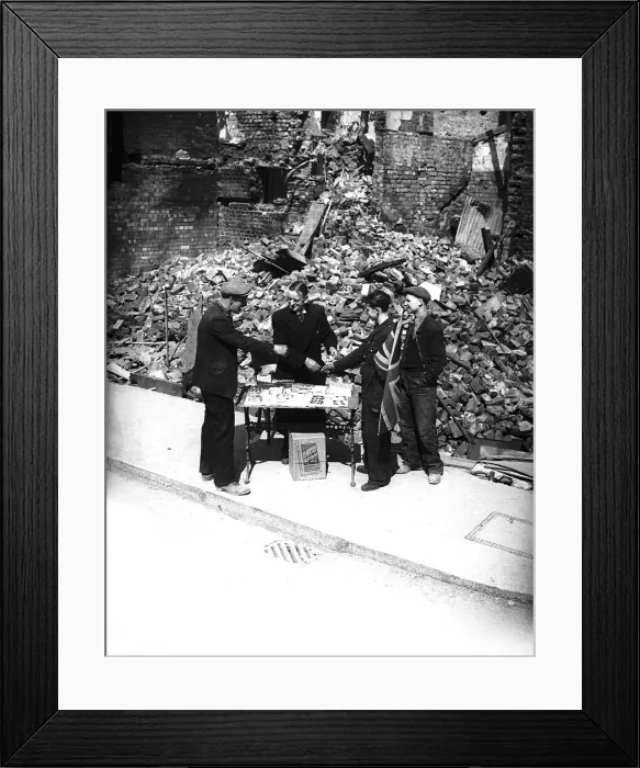 Framed Print : Tobacconist sells cigarettes outside bombed shop during London blitz Framed Print : Tobacconist sells cigarettes outside bombed shop during London blitz