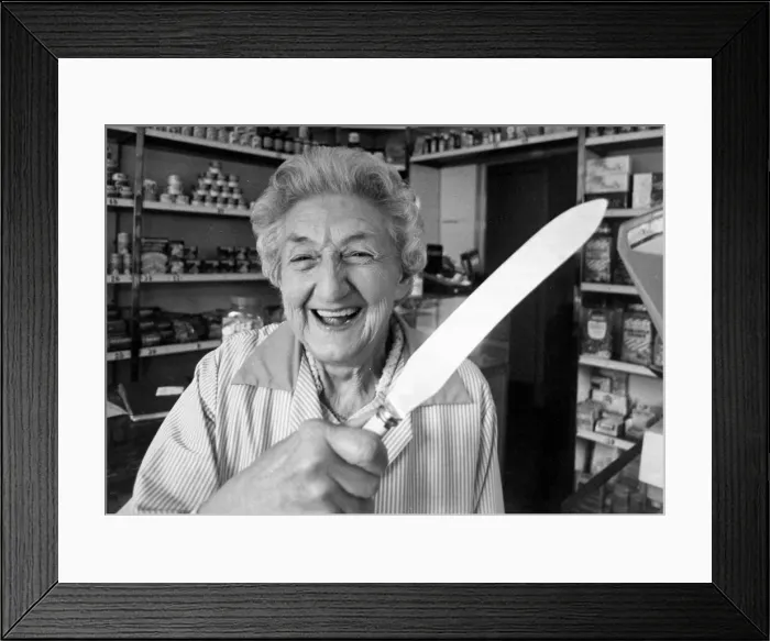 Framed Print : Shopkeeper Dorothy Gleave holding a knife that she used to chase away two armed teengaers Framed Print : Shopkeeper Dorothy Gleave holding a knife that she used to chase away two armed teengaers