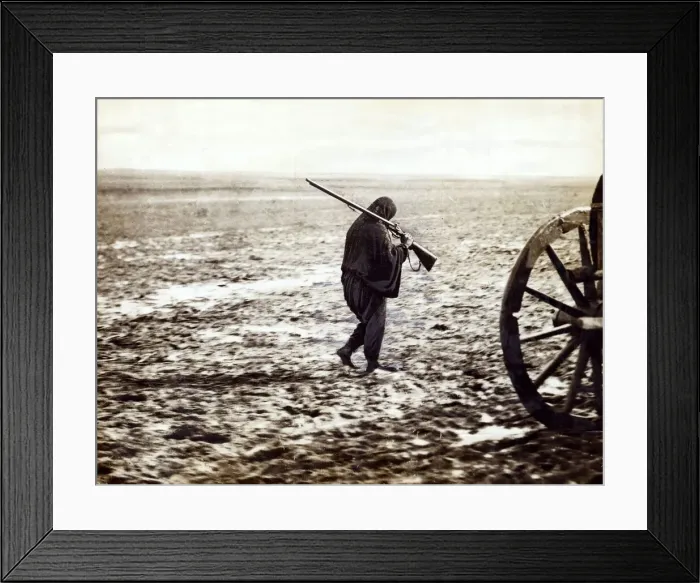 Framed Print : Balkan war 1912 A Turkish refugee walking on the mire of the high road to