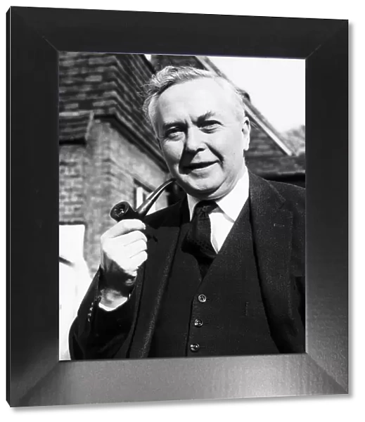 Harold Wilson MP smoking his pipe 1964