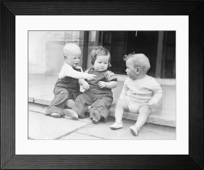 Framed Print : Three babies sitting on a front doorstep. Circa 1950 Framed Print : Three babies sitting on a front doorstep. Circa 1950