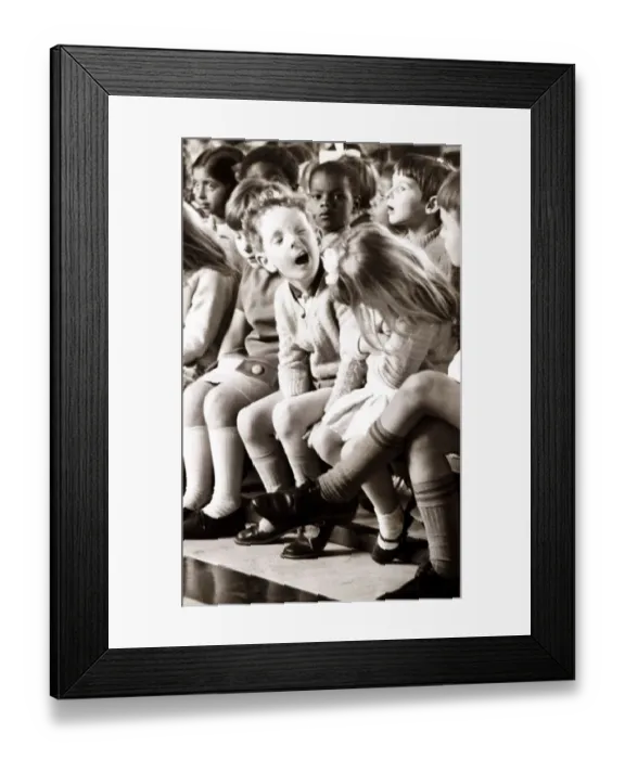Framed Print : Boy pulling a funny face to the girl next to him. Circa 1960 Framed Print : Boy pulling a funny face to the girl next to him. Circa 1960