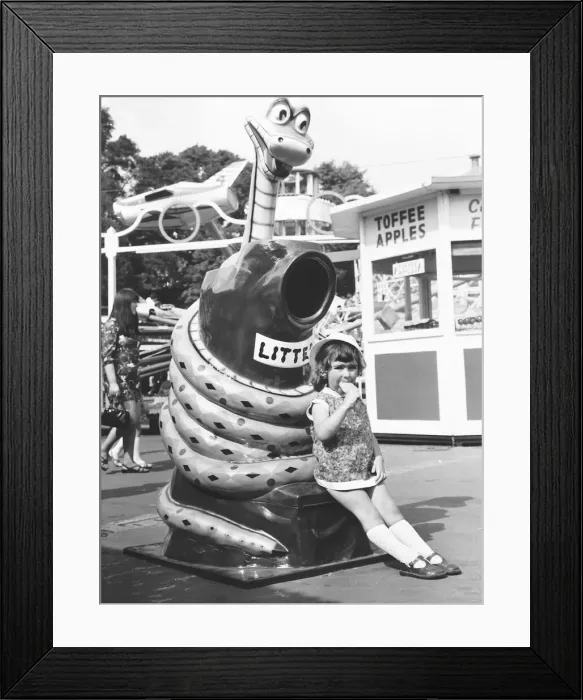 Framed Print : Three year old Christine Elliot from Harpenden hurries through her ice-lolly so that she Framed Print : Three year old Christine Elliot from Harpenden hurries through her ice-lolly so that she