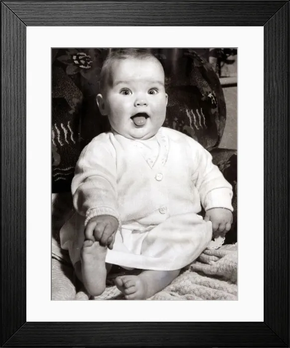 Framed Print : Cheeky little baby girl, circa 1950
