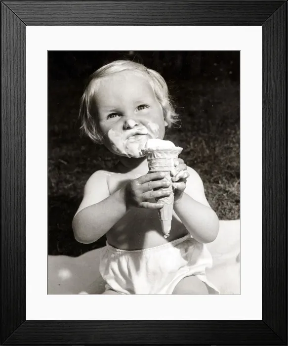 Framed Print : This girl is really enjoying her ice cream. Circa 1950 Framed Print : This girl is really enjoying her ice cream. Circa 1950