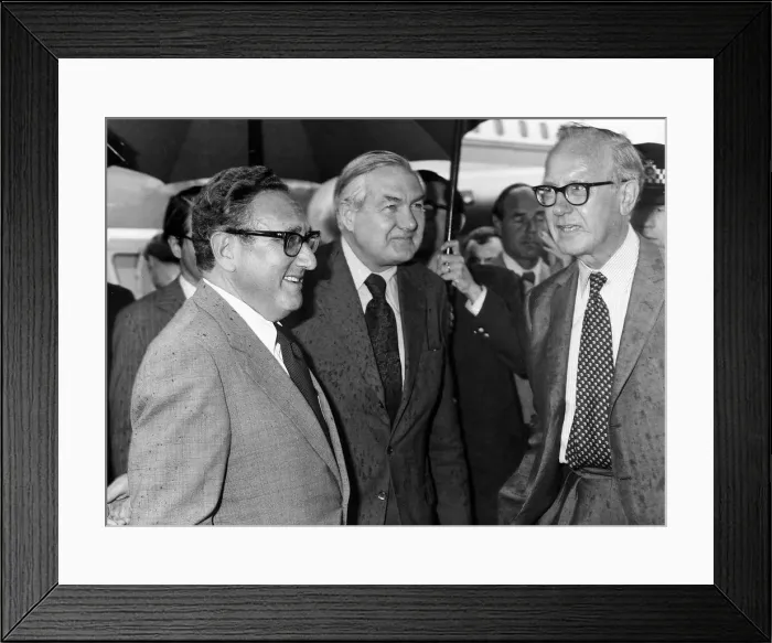 Framed Print : James Callaghan meets with Henry Kissinger at Heathrow Airport in the rain 1975