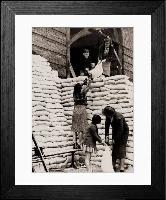 Framed Print : Parents and children help sandbag the main entrance to the Manchester Grammar School