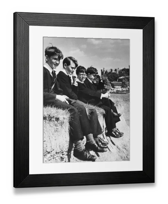 Framed Print : Eton pupils sitting on the edge of river bank of the Thames at Windsor. 1955 Framed Print : Eton pupils sitting on the edge of river bank of the Thames at Windsor. 1955