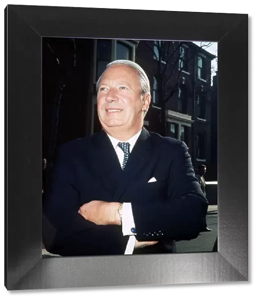 Conservative Prime Minister Edward Heath standing with arms folded outside 10 Downing