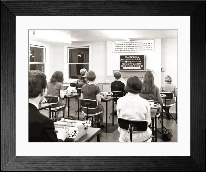 Framed Print : Rosemary park aged 16 sits in a happy trance at her typewriter her eyes fixed on flashing Framed Print : Rosemary park aged 16 sits in a happy trance at her typewriter her eyes fixed on flashing