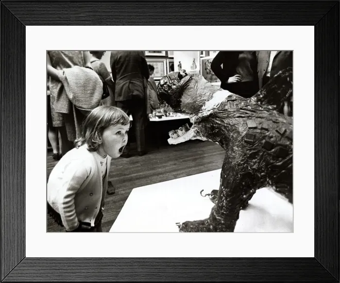 Framed Print : Three year old Cheryl Thomas looking at a sculptured monster at the National Exhibition Framed Print : Three year old Cheryl Thomas looking at a sculptured monster at the National Exhibition