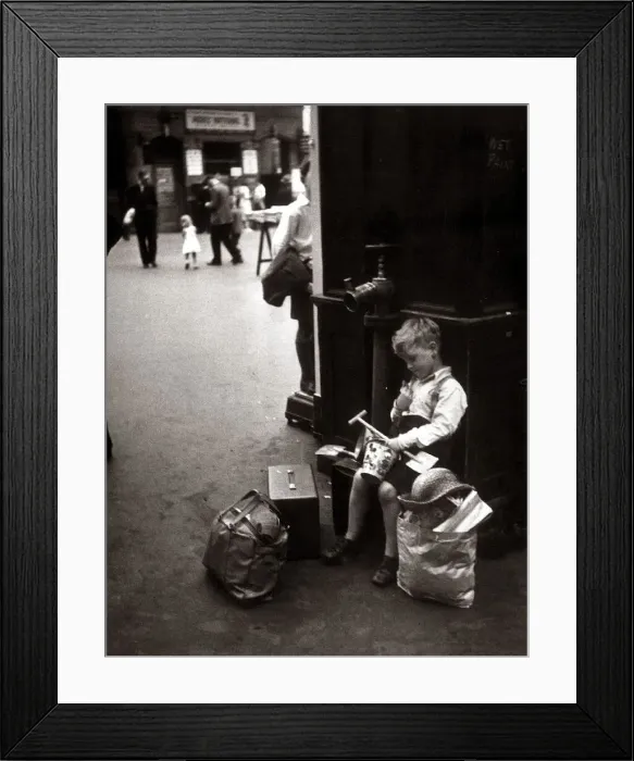 Framed Print : A little boy Kenneth James waits for his train at the station ready to take him home Framed Print : A little boy Kenneth James waits for his train at the station ready to take him home