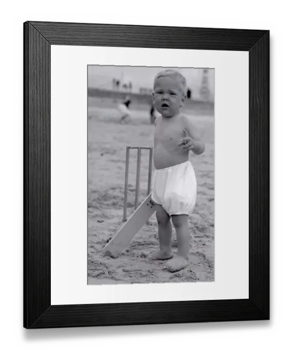 Framed Print : The next Jack Hobbs stands at the crease ready to bat in a game of beach cricket Framed Print : The next Jack Hobbs stands at the crease ready to bat in a game of beach cricket