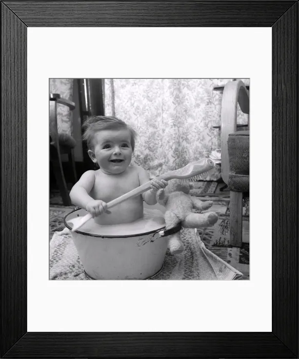 Framed Print : Bathtime for 10 month old Julie Cooper. December 1955 Framed Print : Bathtime for 10 month old Julie Cooper. December 1955