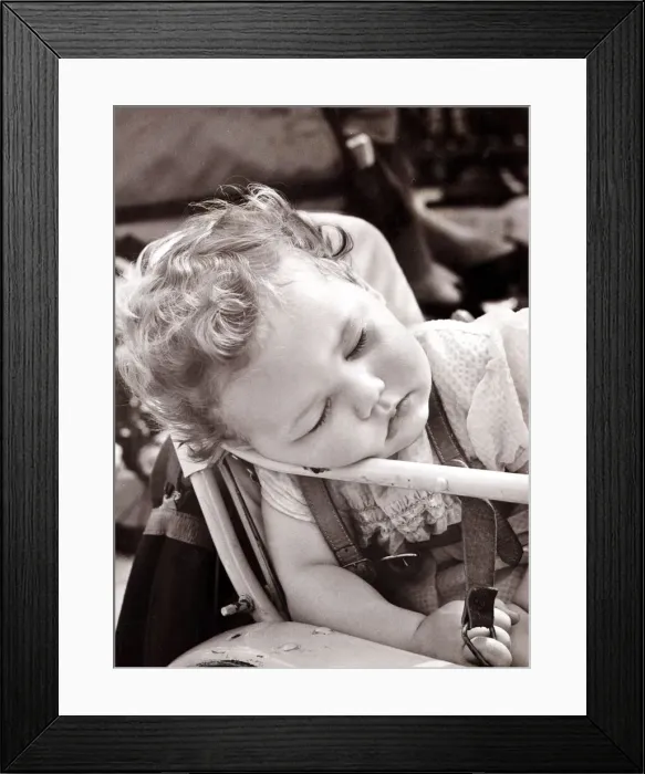 Framed Print : Tired baby in pram, circa 1950 Framed Print : Tired baby in pram, circa 1950