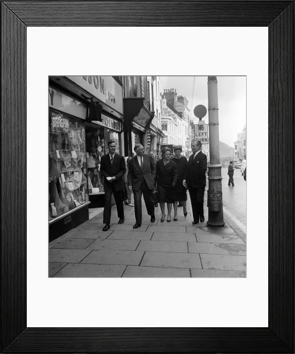 Framed Print : Harold Wilson with his wife Mary and son Robin (left) walk along the seafront with