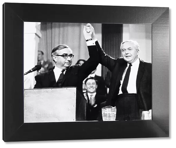George Brown MP with Harold Wilson arms raised in air following Brown