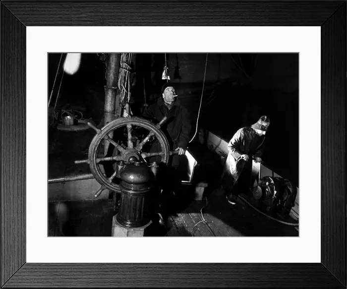 Framed Print : Skipper Harry Evans at the wheel of the Thames sailing barge Ardwina as she rounds Beachy