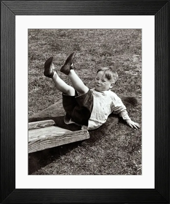 Framed Print : Kid playing in the garden, circa 1950