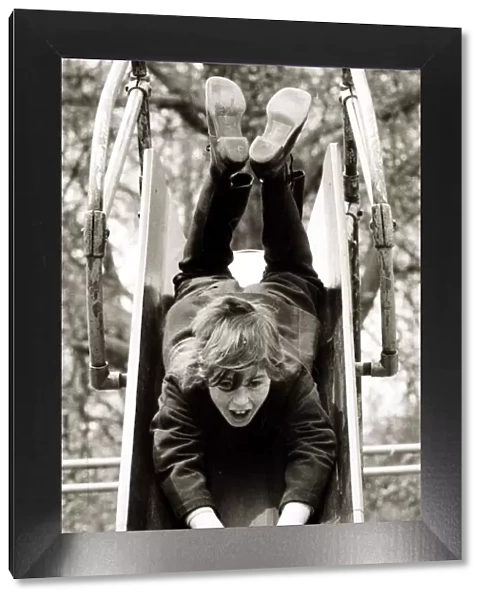 Girl on a slide, circa 1980
