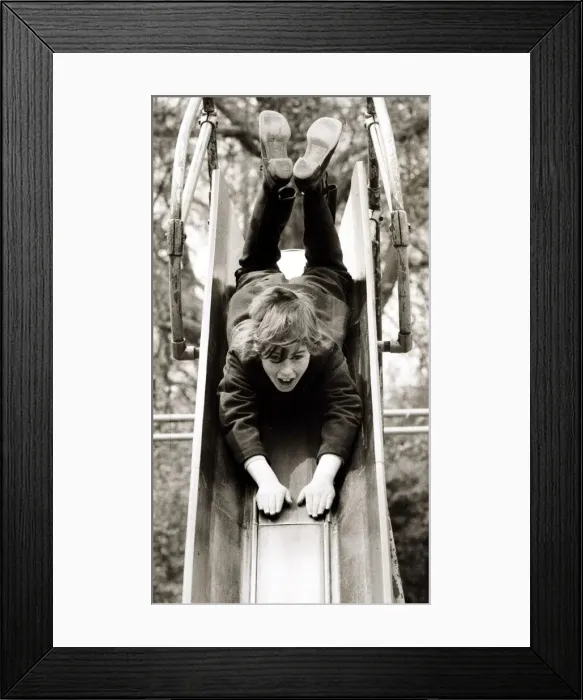 Framed Print : Girl on a slide, circa 1980 Framed Print : Girl on a slide, circa 1980