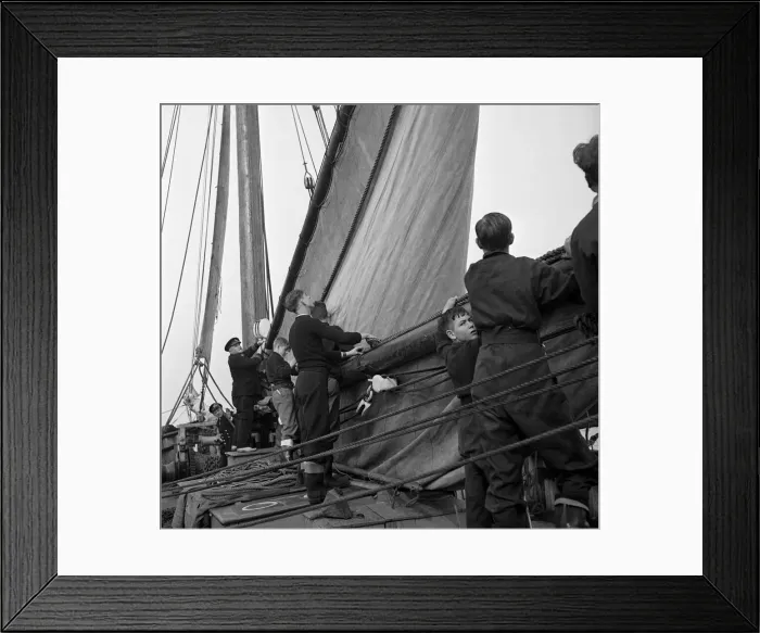 Framed Print : Students attending the Outward Bound Sea School at Aberdovey seen here with one of