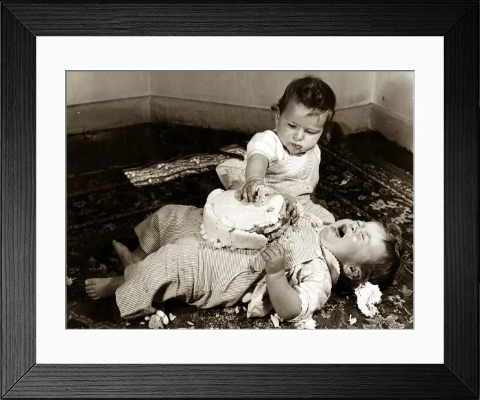 Framed Print : Two babies enjoying their birthday cake. Circa 1950 NO USE FOR GREETINGS