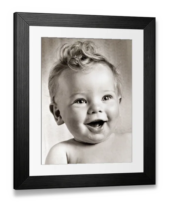 Framed Print : Happy baby boy with a stylish haircut. Circa 1950