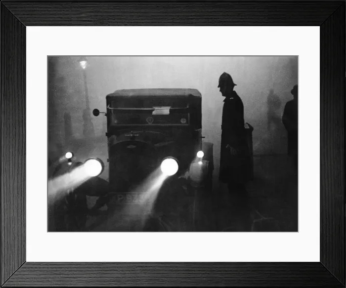 Framed Print : A motor car with headlights full on in the Strand in an attempt to lighten the gloom of