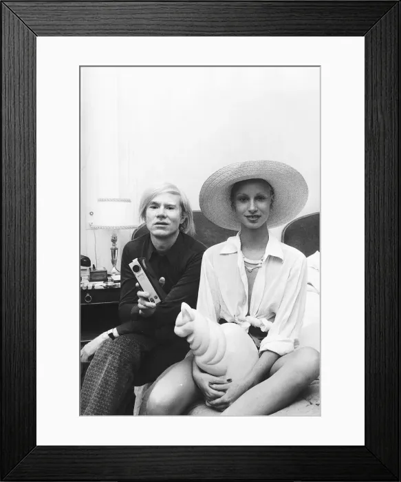 Framed Print : Andy Warhol with one of his leading ladies at a press conference to introduce his new Framed Print : Andy Warhol with one of his leading ladies at a press conference to introduce his new