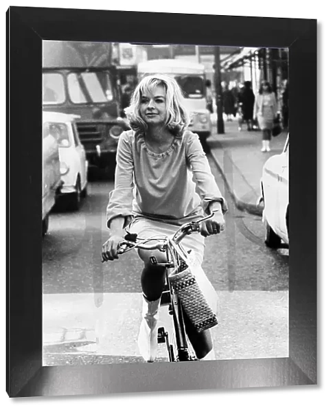 Actress Susannah York oct 1965 riding a bike on Kings road Chelsea