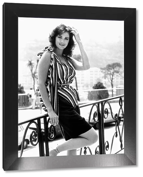 Actress Lynda Carter in July 1983, relaxing against a balcony during her stay in Monte