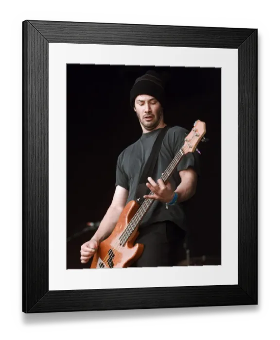 Framed Print : Keanu Reeves on stage June 1999 performing at the Glastonbury Festival with his Framed Print : Keanu Reeves on stage June 1999 performing at the Glastonbury Festival with his