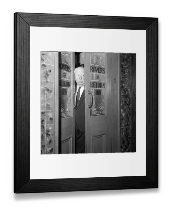 Framed Print : Alfred Hitchcock - film director - June 1964 In studio 2 with props from