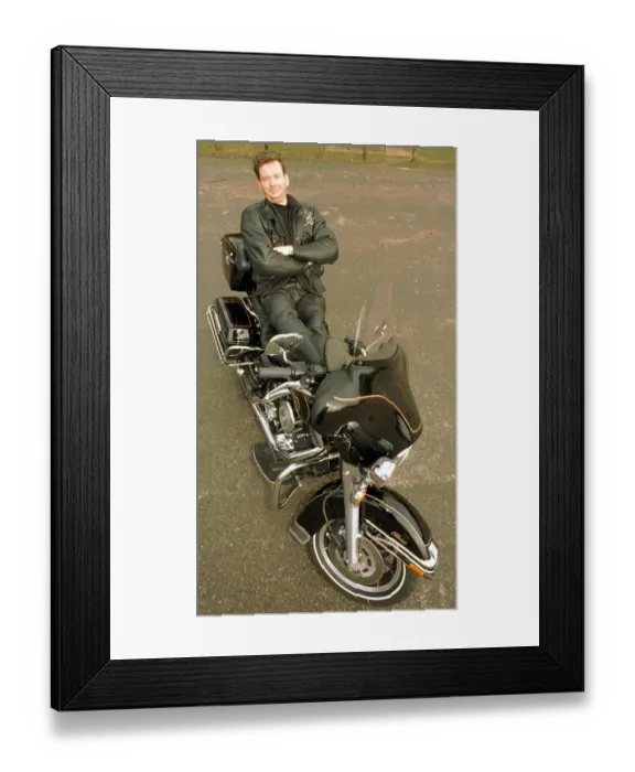 Framed Print : John Gordon Sinclair actor leaning back on his Harley Davidson Electra Glide motorcycle
