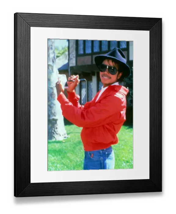 Framed Print : Michael Jackson signing his autograph at his home. April 1984