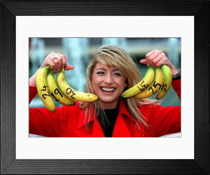 Framed Print : Dani Behr TV Presenter - numbers on bananas for her Lottery Show