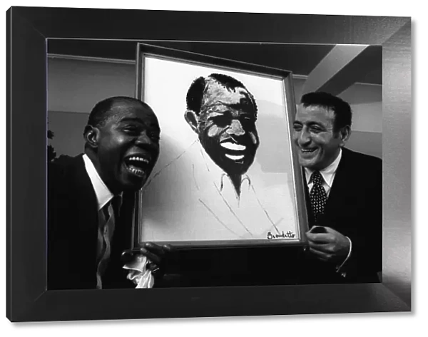 Tony Bennett presents Louis Armstrong a painting. 1970