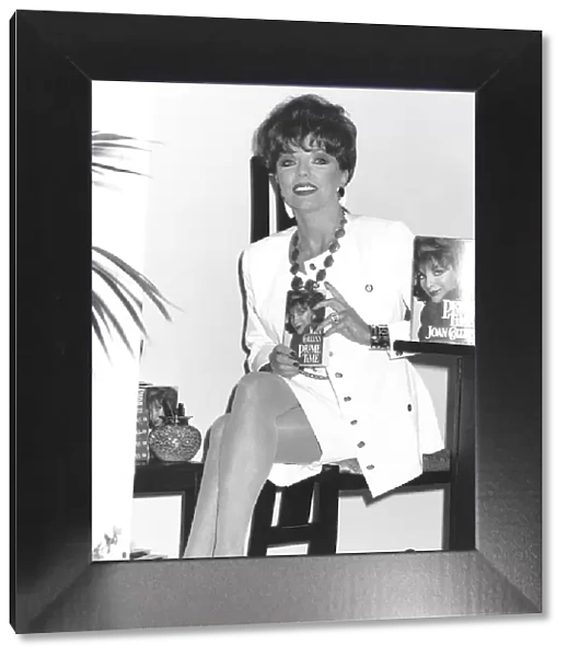 Joan Collins Actress sitting at the signing of her new book Prime Time June 1989