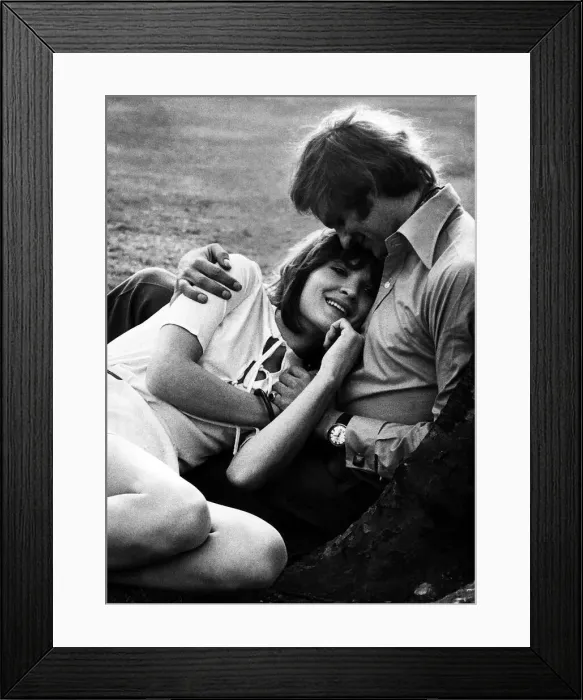 Framed Print : A couple in a park hugging each other Framed Print : A couple in a park hugging each other