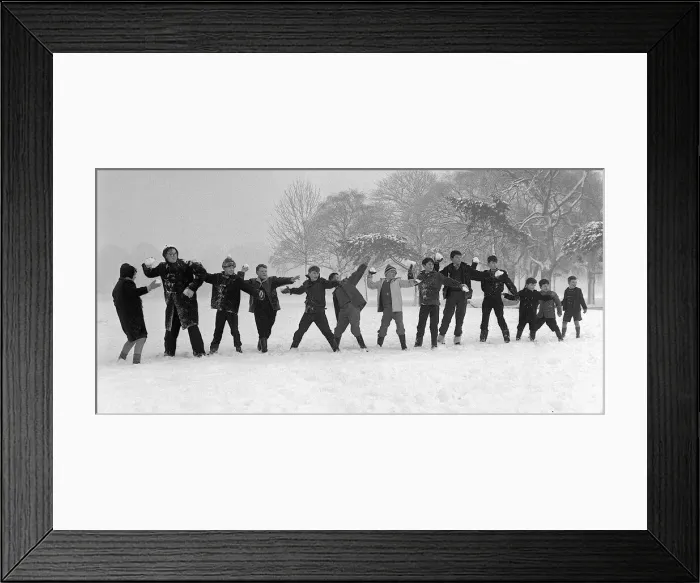 Framed Print : Children on holiday from school throwing snowballs and playing in the snow on Tooting Bec Framed Print : Children on holiday from school throwing snowballs and playing in the snow on Tooting Bec
